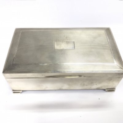 A Birmingham hallmarked silver cigar box circa 1963. Approximately 15.5cm wide 6cm tall and 9cm deep.