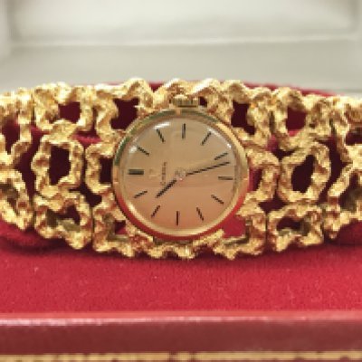 A boxed Omega 18ct gold ladies watch, with paperwork. 53.9g total weight. Postage category A