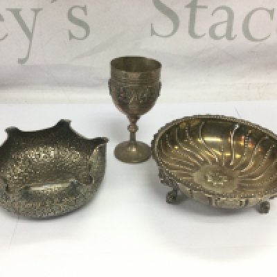 Three pieces of Indian and Persian silver comprising two bowls and a small goblet. Shipping category B.