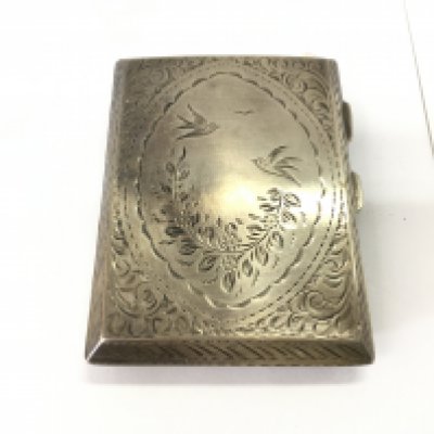 A silver cigarette case 65.66g Postage B