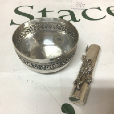 A Silver Chinese bowl with a floral pattern edge and Greek Key pattern marks to the base diameter 6.5cm and a round container with hinged top. (2)