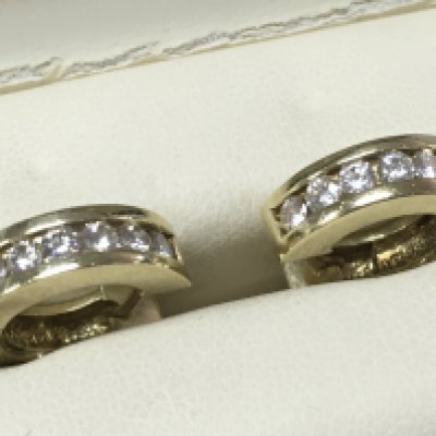 A pair of small hoop 14ct and diamond earrings , 9g total weight. Postage category A