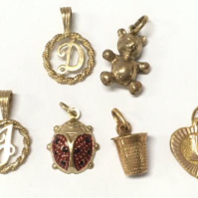 A collection of 9ct gold charms