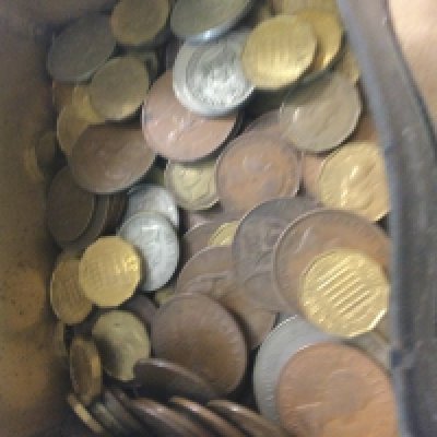 A small tin containing coinage various.