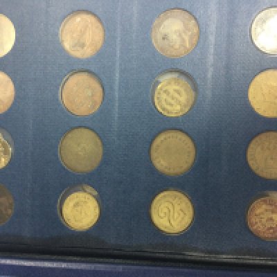 A Album containing various coins various.