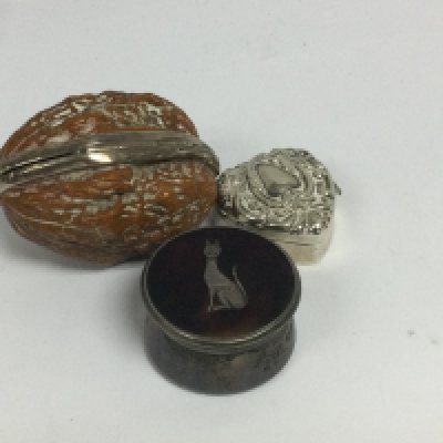 Three pill boxes including silver.