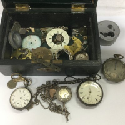 A jewellery box containing various pocket watches and parts. Shipping category D.