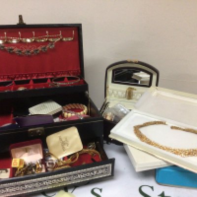 A collection of Costume jewellery including some silver in two jewellery boxes tin and other boxes.