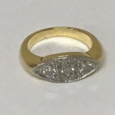 An unmarked ring set with a pattern of diamonds weight 8.3 grams.