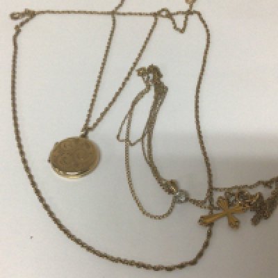 Four 9carat gold chains with an attached gold locket cross pendent and one ther and one gold chain. Weight 13g (4)