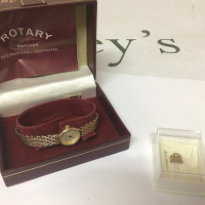 A 9carat ladies Rotary Watch in a fitted box with paperwork and extra link. Weight 15g