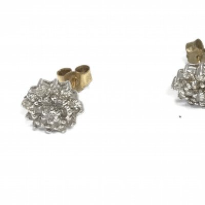 A pair of diamond cluster earrings. 2.56g Postage A