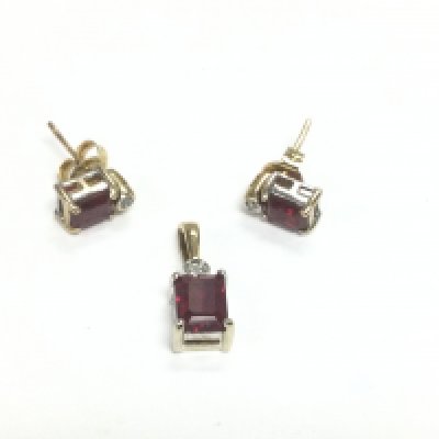 A 9ct gold, synthetic ruby and diamond jewellery suite comprising a pendant and pair of earrings, total approx weight 2.5g. Shipping category A.-