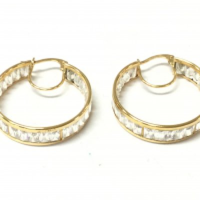 An unhallmarked high grade gold pair of hoop earrings set with white stones. 6.02g Postage B