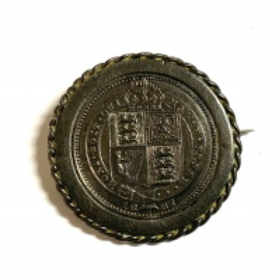 An 1887 Jubilee sixpence in silver brooch mount.- NO RESERVE