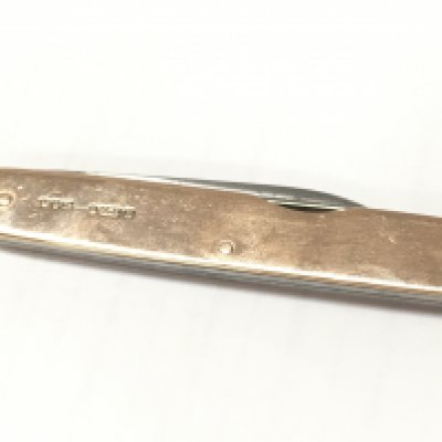 A 9ct gold pen knife . Postage category A
