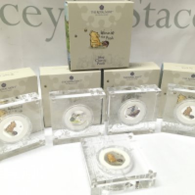 Five cased Winnie the Pooh 2020 silver proof 50p coins . Postage category B