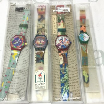 Four modern design Swatch watches . Postage category b