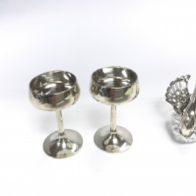 A pair of Chinese silver mini wine cups and a hallmarked silver and crystal swan.
