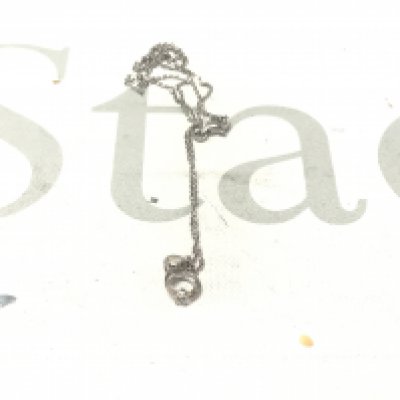 18ct white gold and silver pendant set with a cubic zirconia, on a silver chain.