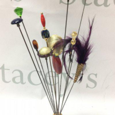 Eleven Victorian mainly long hat pins. Postage category B