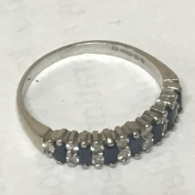 An 18carat white gold ring set with sapphire and alternating diamonds. Weight 2.6g