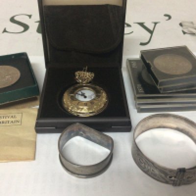 A silver buckle bangle napkin ring gold plated pocket watch and coins