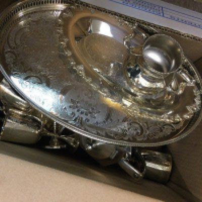A box containing silver plated ware various and a canteen of cutlery,