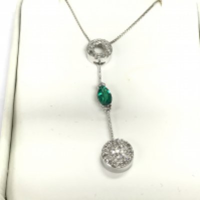 A 9ct gold necklace set with small diamonds and an emerald. 2.46g