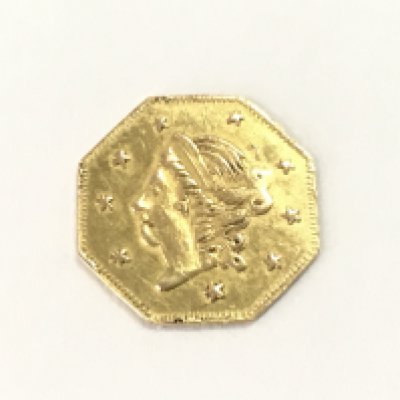 A small 1871 gold hexagonal dollar / token.Postage A