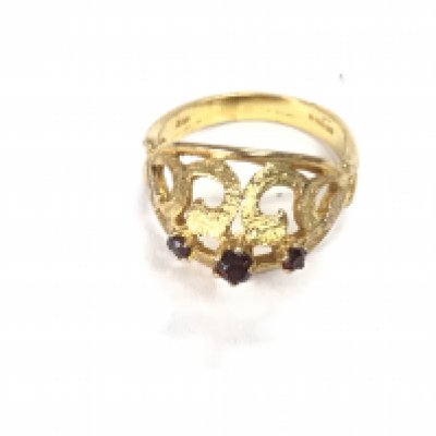 A 9ct gold ring set with rubys. Size O and 4.37g Postage A