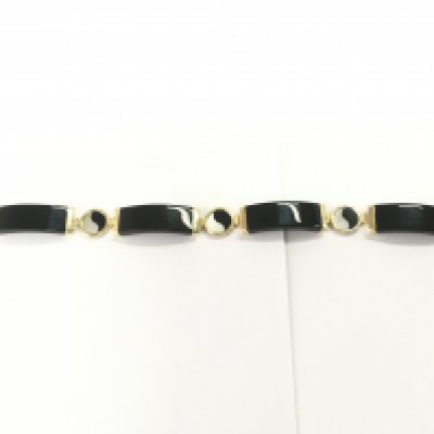A 14ct gold and black phenolic bracelet. 19cm length and 16.52g
