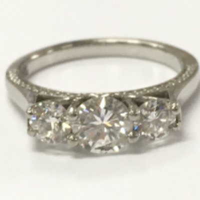 A white gold 3 stone diamond ring, size K, 5.2g total weight. with good clarity.