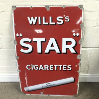 A Wills star cigarettes advertising sign24 x 37 inches approximately