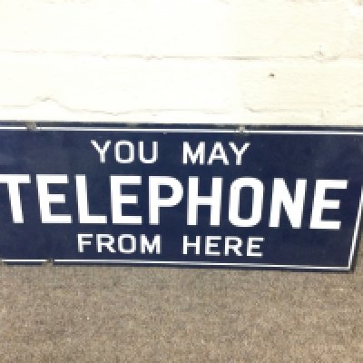 A vintage double-sided enamel sign "You May Telephone From Here&ldquo; 22 x 9 inches approximately