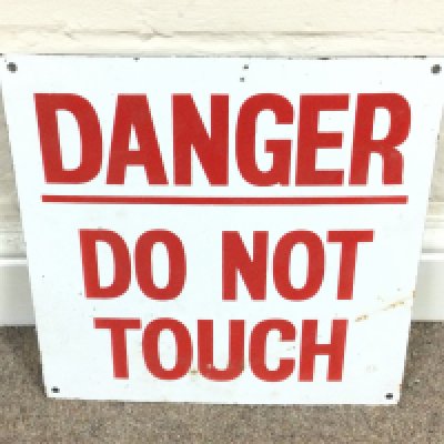 A danger do not touch enamel sign. 12 x 12 inches