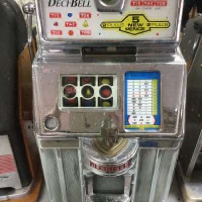 A 'Deci-Bell' (Jennings) one armed bandit 15 x 28 x 15 inches approximately