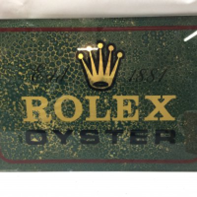 A vintage glass Rolex Oyster advertising sign dimensions 38x26cm. This lot cannot be posted