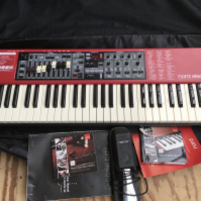 A cased Nord Electro 4D keyboard with expression pedal, booklets and CD.