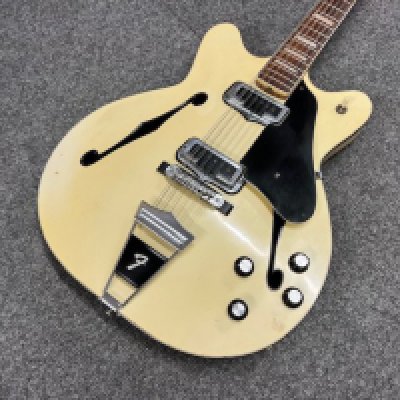 A 1967 Fender Coronado XII twelve string electric guitar in Olympic White with binding. All original parts and original pick guard. Good condition overall with some play-wear and marking to paintwork. No case