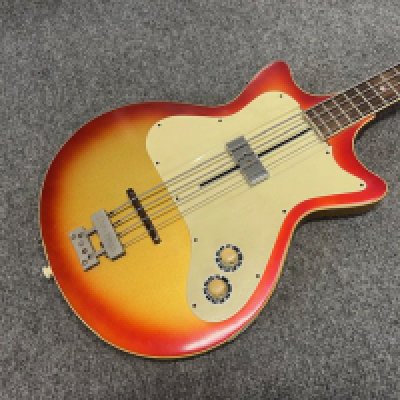 A 1959 Framus Hollywood Star Bass Ultra Short Scale Bass Guitar model number 5/148 and quite rare. Single sliding pickup metallic gold to red sunburst finish. All original with original Van Gent "star" tuners stamped Framus to housing. Some loss of paint to back and sides consistent with age and use. Comes with non original hard case as would have originally come with optional extra vinyl case.