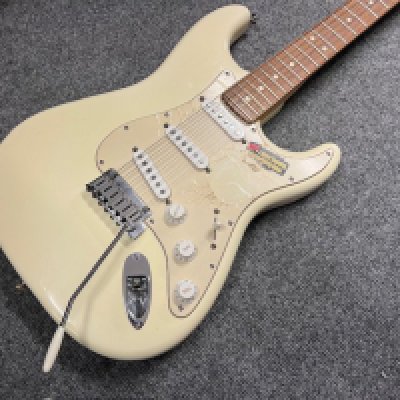 This is an unplayed 2003 Fender Stratocaster in faded Olympic White finish - cream. Rosewood board. This is a completely unplayed guitar with the plastic and store stickers still on the pickguard and trem cavity cover. Comes with its original Fender indent case and all paperwork and case candy present for a 2003 Stratocaster. Condition wise unplayed with no fretwear or evidence of any playwear marking etc.