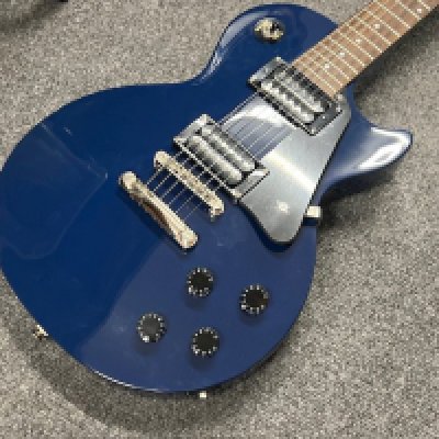 An as new condition Epiphone Les Paul Studio electric guitar in Blue. Twin Humbuckers and rosewood board with chrome parts and brightwork. As new condition unplayed with plastic still on the pick guard.