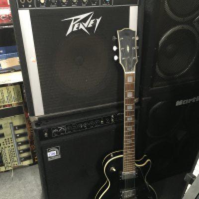 A Japanese made Custom style electric guitar and a Peavey Pacer amplifier (2).