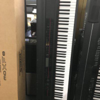 A boxed Korg Kross music work station with stand (2).