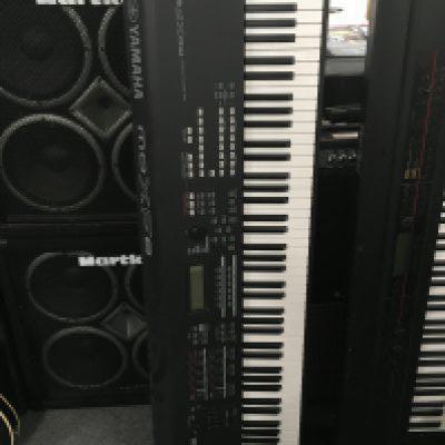A Yamaha MO XF 8 synthesiser and stand (2).
