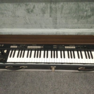 A 1998 Roland VK-7 tonewheel organ with a hard carry case (not original).