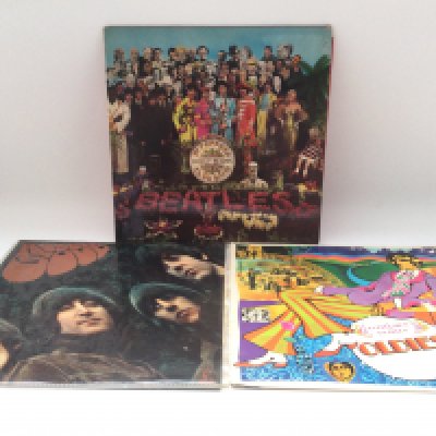 Three Beatles LPs comprising a German pressing of 'Sgt Pepper', feelable scratch on Side A, plus 'Rubber Soul' and 'A Collection Of Beatles Oldies'.