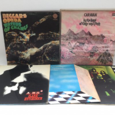 Eleven prog rock LPs by various artists including early UK pressings by Beggars Opera, Caravan, Yes and others.