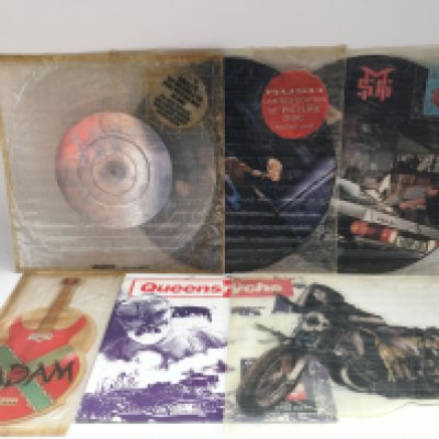 A collection of picture discs and shaped discs by various artists including Rush, Styx and others plus some LPs by David Bowie, The a Rolling Stones and others.